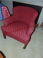 red cloth side chair on wheels