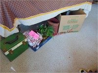 Group of decor items: green suitcase, towels,