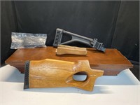 Rifle parts, handgun handle, wooden shelf