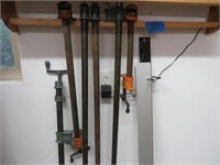 assortment of pipe clamps and straight edge