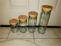 4 Jars with wooden Lids