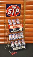 Vintage NOS STP metal rack & (12) unopened tins