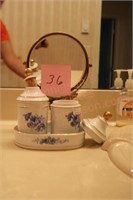 Small brass hand mirror w/blue & white counter