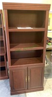 Sauder library bookcase with two doors below, two