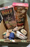 Box lot of collector toys including a kiss