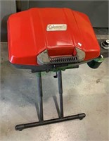 Coleman portable grill, two wheels on the side,