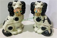 Vintage Staffordshire terrier dogs, holding a