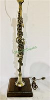 Antique silver clarinet table lamp, with a