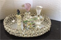 Decorative table mirror with perfume bottles,