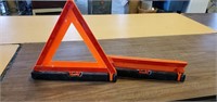 Two folding caution triangles