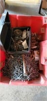 Plastic tote full of nails