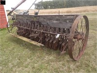 Antique IH end wheel steel wheeled press drill