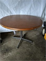 Wood table top with metal legs 
29" Tall