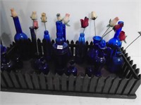Collection of Blue Bottles and Carrier
