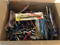 Box full of pens and pencils some new