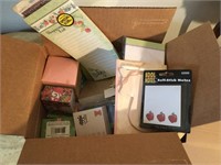 Large box of notepads and sticky notes