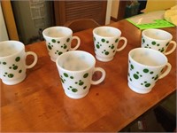 Six green polkadot mugs