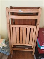 Two wooden folding chairs