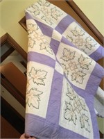 Embroidered quilt with leaf pattern