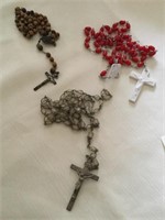 Three sets of rosary beads one broken
