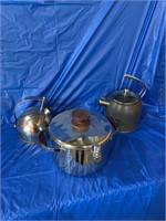 A pair of kettles and a pressure cooker