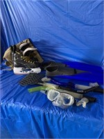 Pair of kids skates, swimming fins and snorkel’s