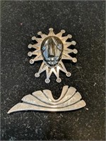Two sterling silver pins