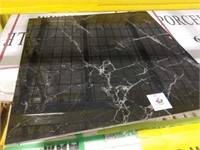 672 square feet a black marble looking tile
