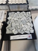 90 square feet of shaved Pebble Gray tile mosaic