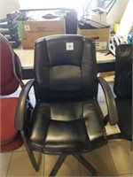 Black office chair tears on front