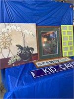 Quantity of pictures and enamel kid cave sign