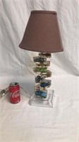 Lamp with toy cars inside glass