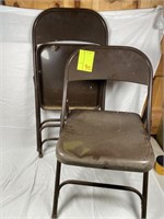 2 older folding chairs