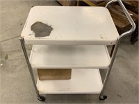 METAL ROLLING CART WITH WORN PAINT