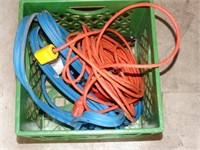 Ext. cords, jumper cables in plastic crate