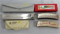 Three Hohner harmonicas in original cases;