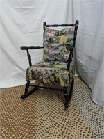 Vintage child wood rocking chair with a music box