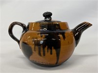 Early redware pottery child’s teapot.