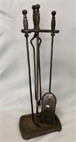 Early wrought iron fireplace tool set.