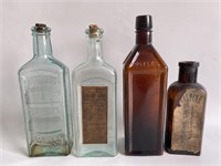 Set of 4 antique bottles.
