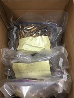 Box lot of polished shell casings, various cal. In