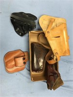An assortment of misc. leather hand gun holsters