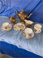 Tea set, cups and saucers