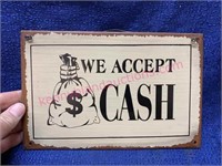 “We accept cash” tin sign