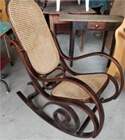 older cane rocking chair in lovely condition