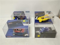 slot car set includes 4 cars, tracks and accessory