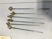 Group of brass handles skewers