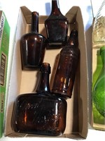 4 collectible amber bottles