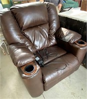 Electric leather recliner shows some wear on arm