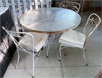 Wrought iron patio chairs and table glass top